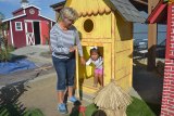 Judy Wait and young Haddie Calvillo enjoy one of the enchanted buildings at the Children's Storybook Garden & Museum.